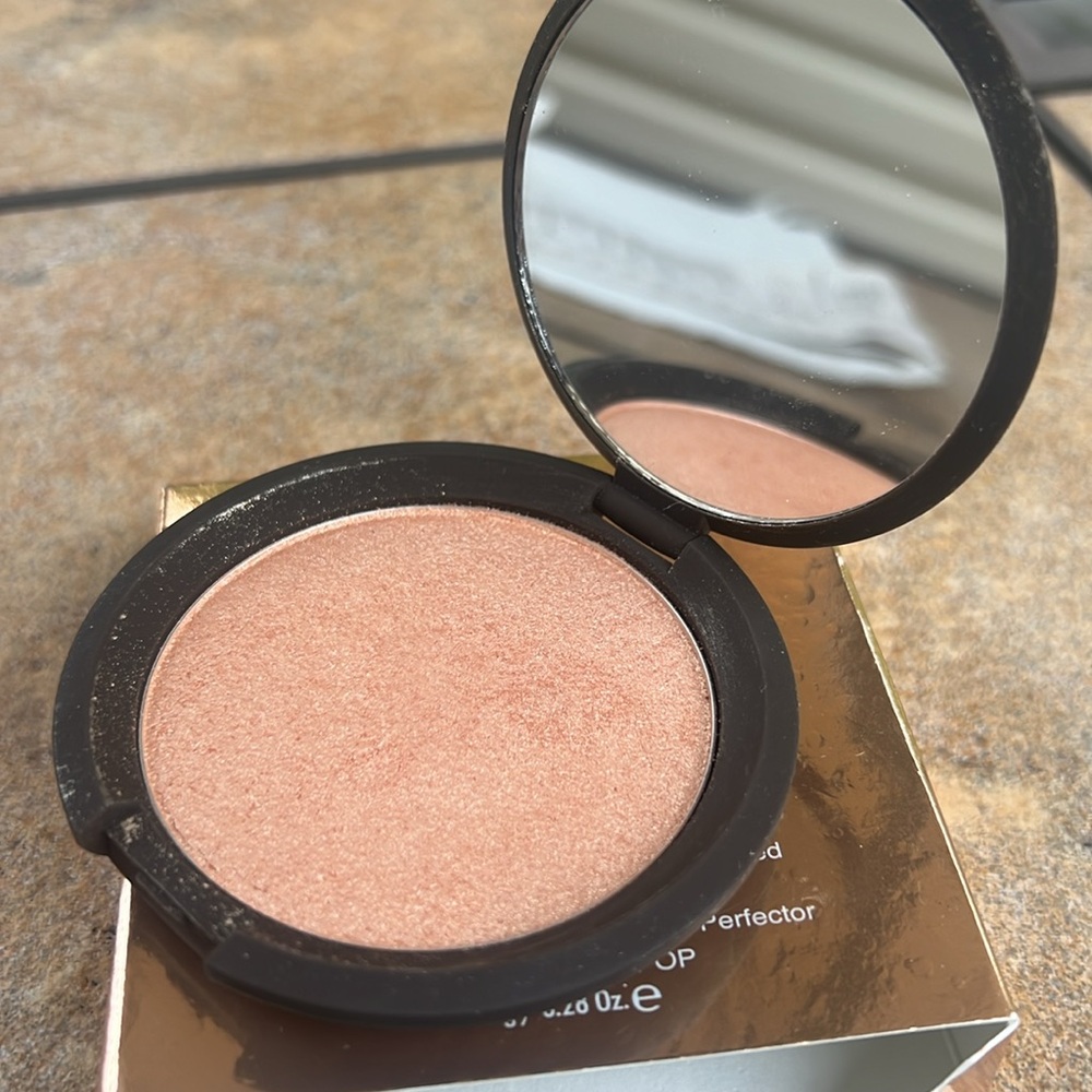 BECCA Limited edition Champagne Pop highlighter. Brand new never used.